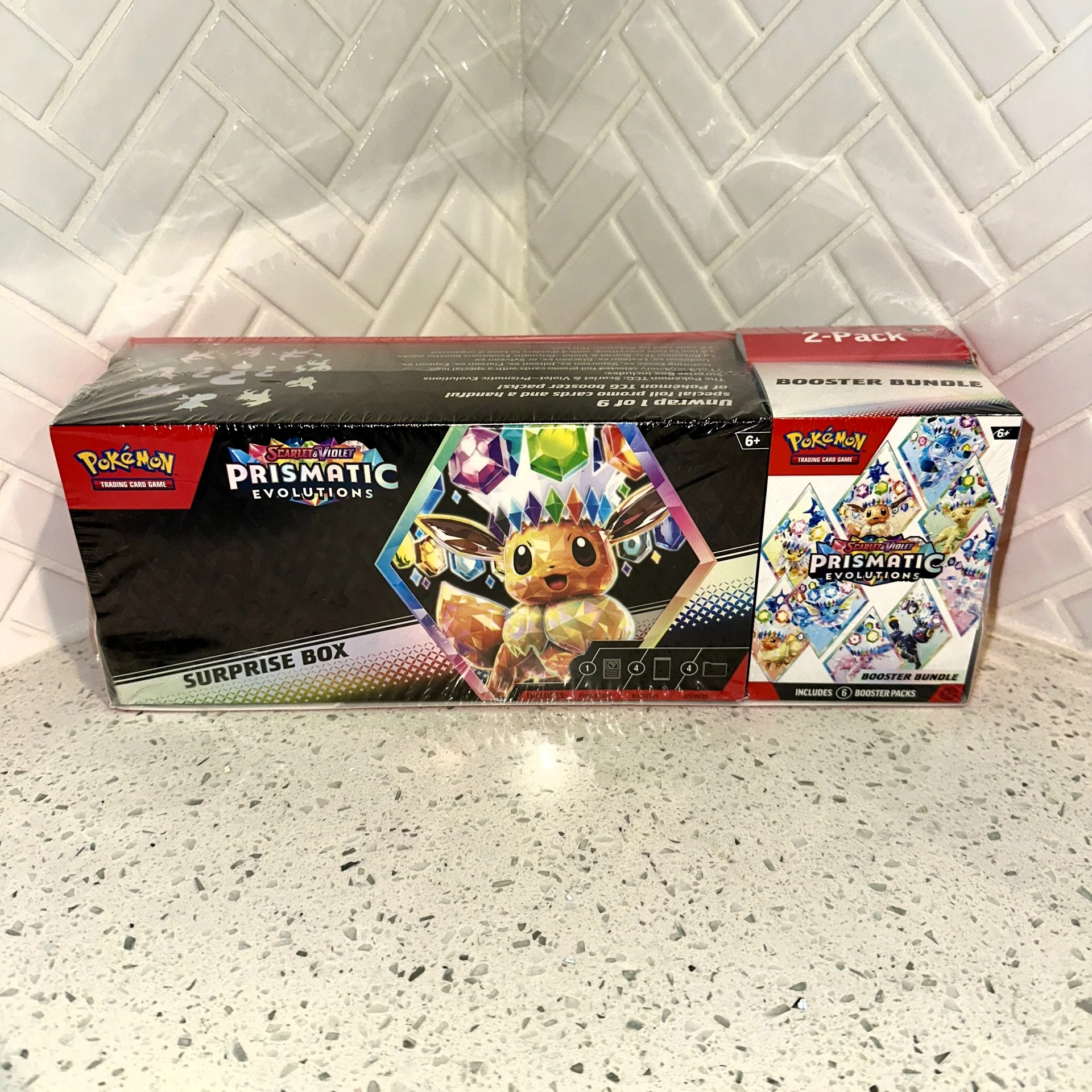 Pokémon TCG: Scarlet & Violet Prismatic Evolutions Surprise Box & Booster Bundle